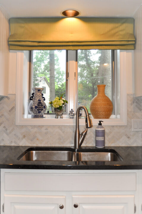 Kitchen staged with clean countertops, fresh flowers and a few decorative elements