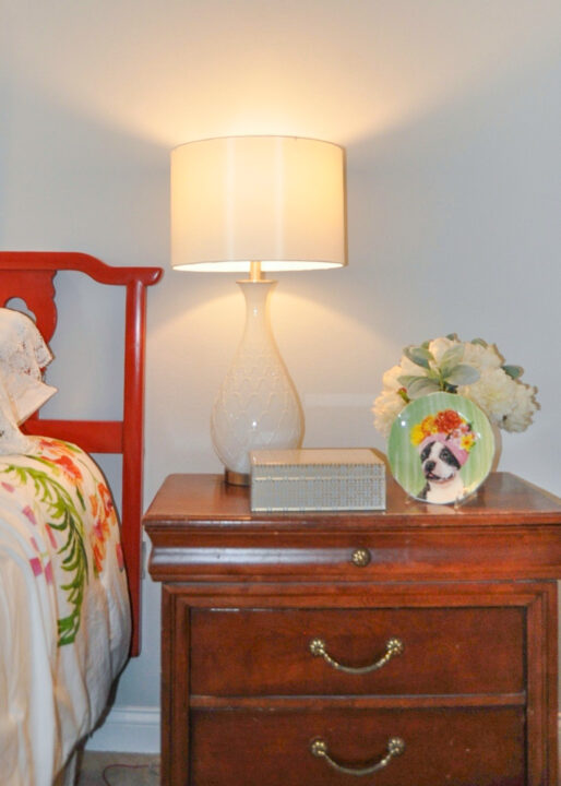 Primary bedroom nighstand styled to attract potential buyers