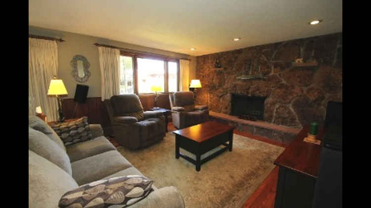 Family room with rock wall fireplace