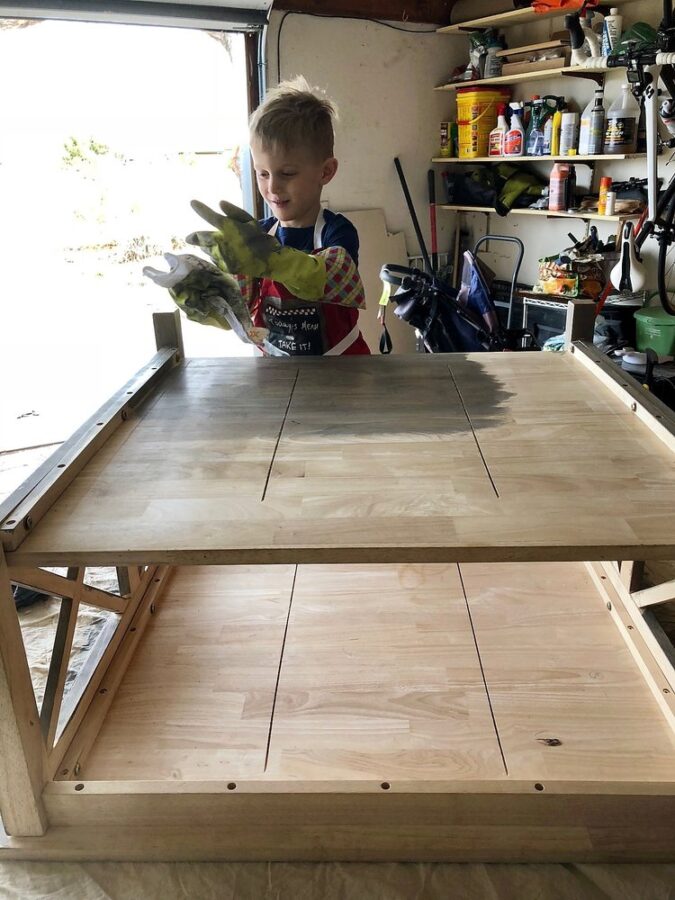 Staining the coffee table with my son.