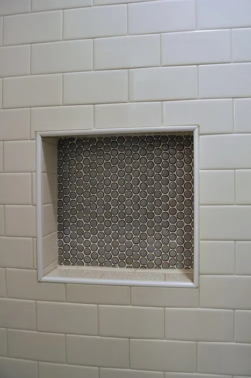 Penny tile inset in the shower