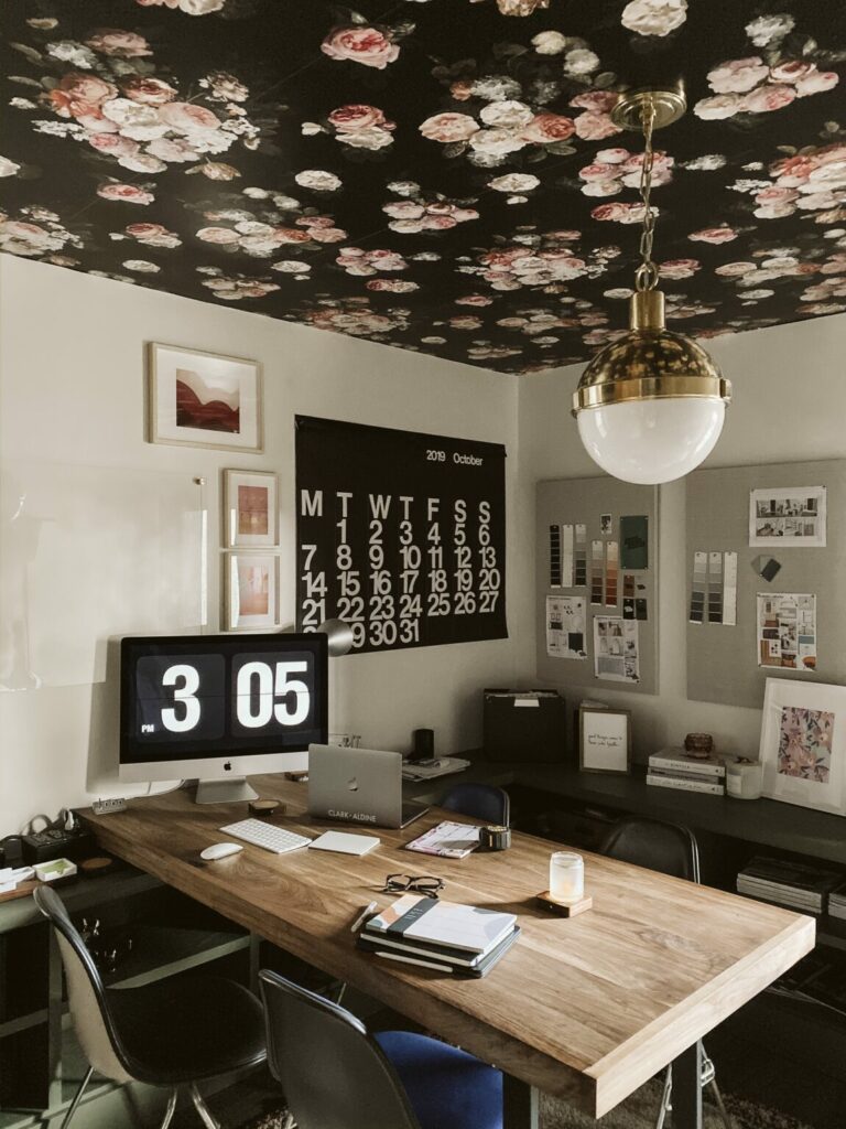 Wallpaper on the ceiling adds an element of surprise to the design