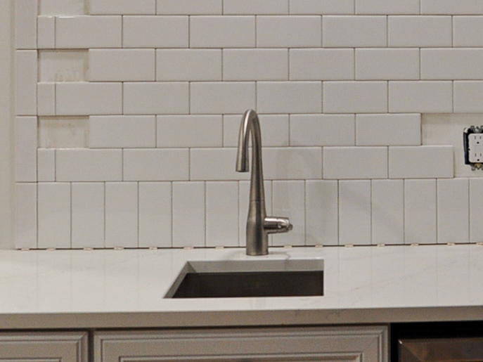 Add tile spacers between the countertop and the first row of tiles | Building Bluebird #kitchenrenovation