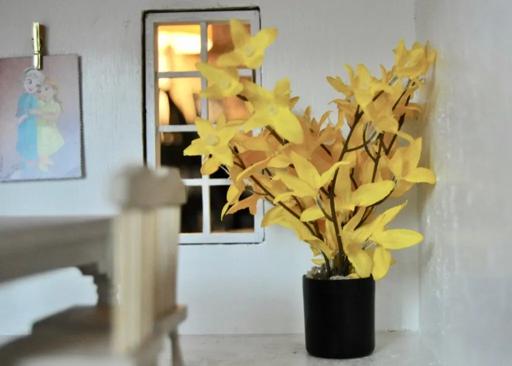 DIY'ed house plant - faux flowers in a hairspray cap