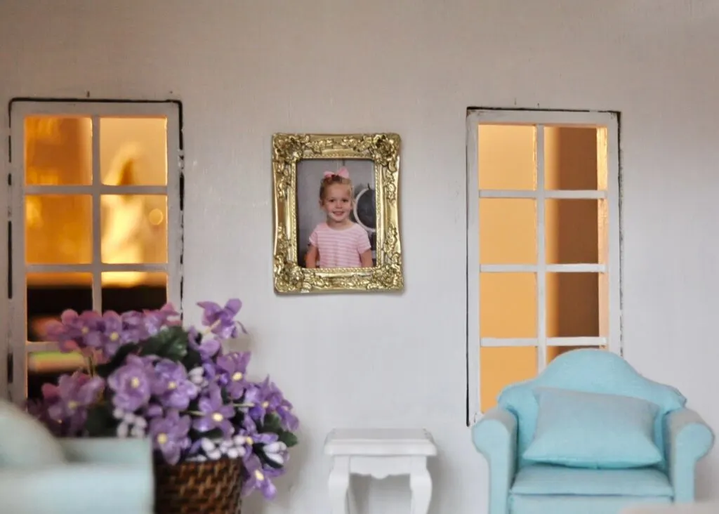 Evelyn's school photo in the living room of the dollhouse