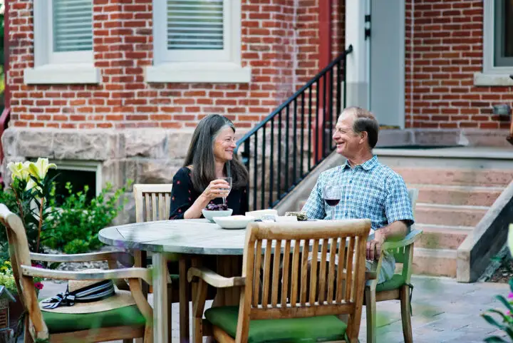 Historic Bosler House garden in Denver with pergola and English flowers