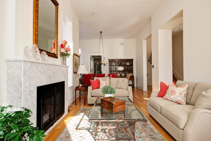 Denver Bosler House living room renovation highlighting Italianate wood windows and historic charm