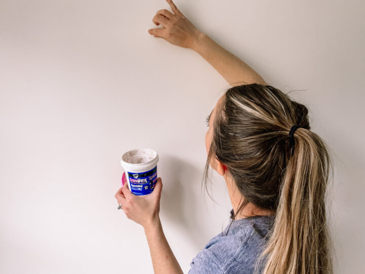 Fill holes in the wall with spackle before painting