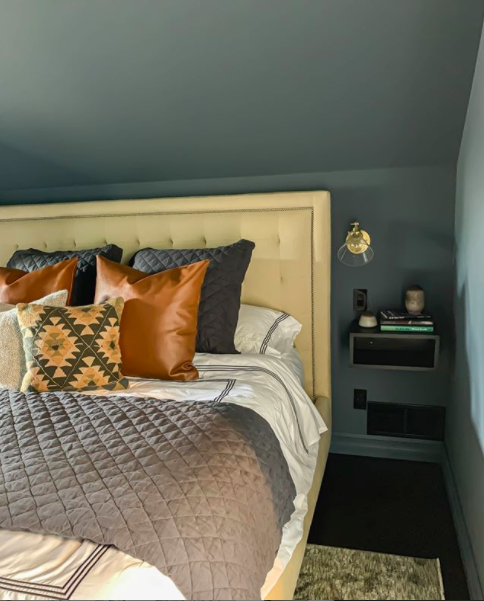 Moody Paint Colors - Outerspace by Sherwin Williams gives this bedroom makeover by Clark + Aldine a super cozy vibe | Building Bluebird