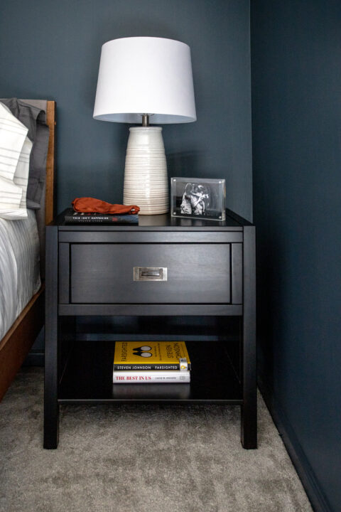Simple nightstand decor with family photos for a personal touch | Building Bluebird #moodybedroom #moodypaint #bhgorc #modernbedroom #targetstyle