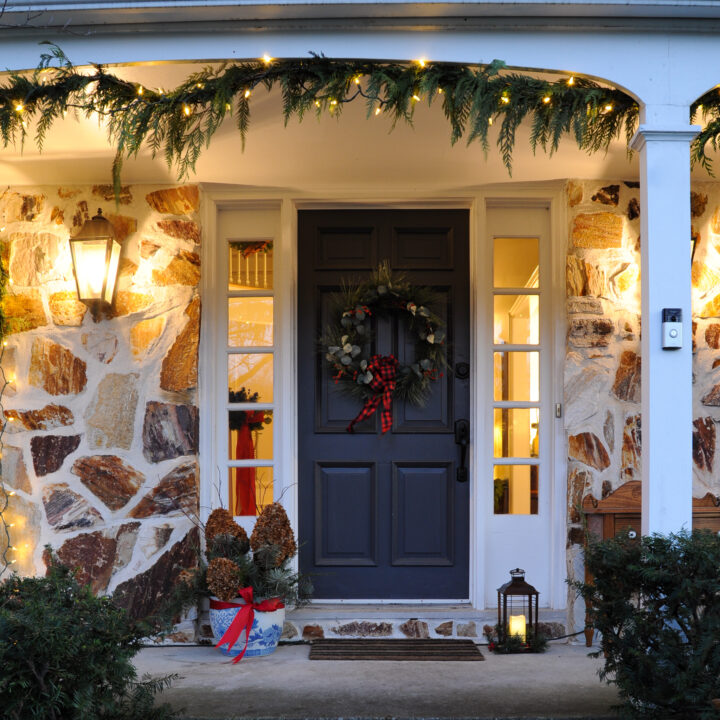 How to hang cedar garland and twinkle lights outside for Christmas | Building Bluebird
