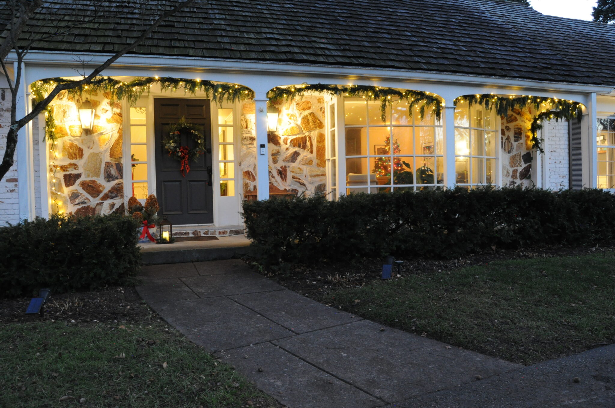 How to Hang Christmas Garland Outdoors with Lights Building Bluebird