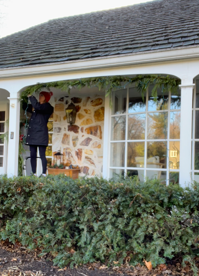 How to hang cedar garland and twinkle lights outside for Christmas | Building Bluebird