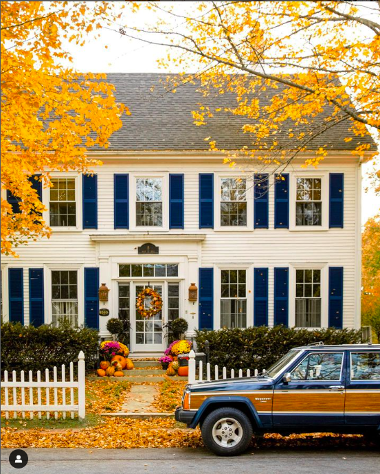 Colonial white house with blue shutters