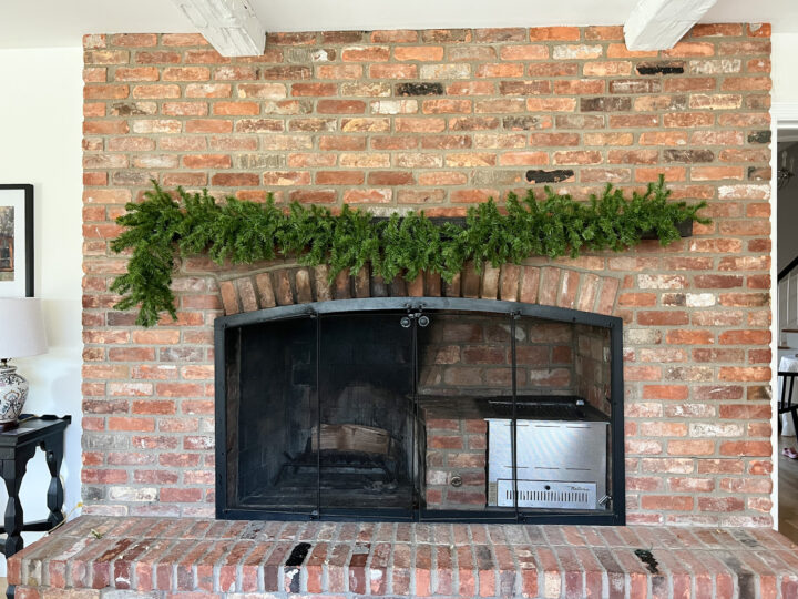 How to hang Christmas garland on your fireplace mantel with an asymmetrical design | Traditional Christmas