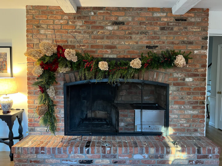 DIY red and green Christmas garland mantel with natural elements | Building Bluebird