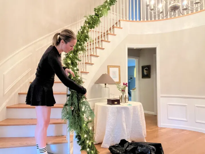 How to DIY and hang a Christmas garland on your staircase | Budget-friendly