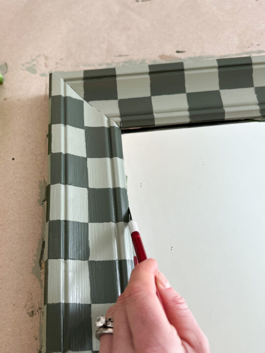 Upcycle an old mirror with this easy and affordable DIY checkered mirror that is perfect for beginners!